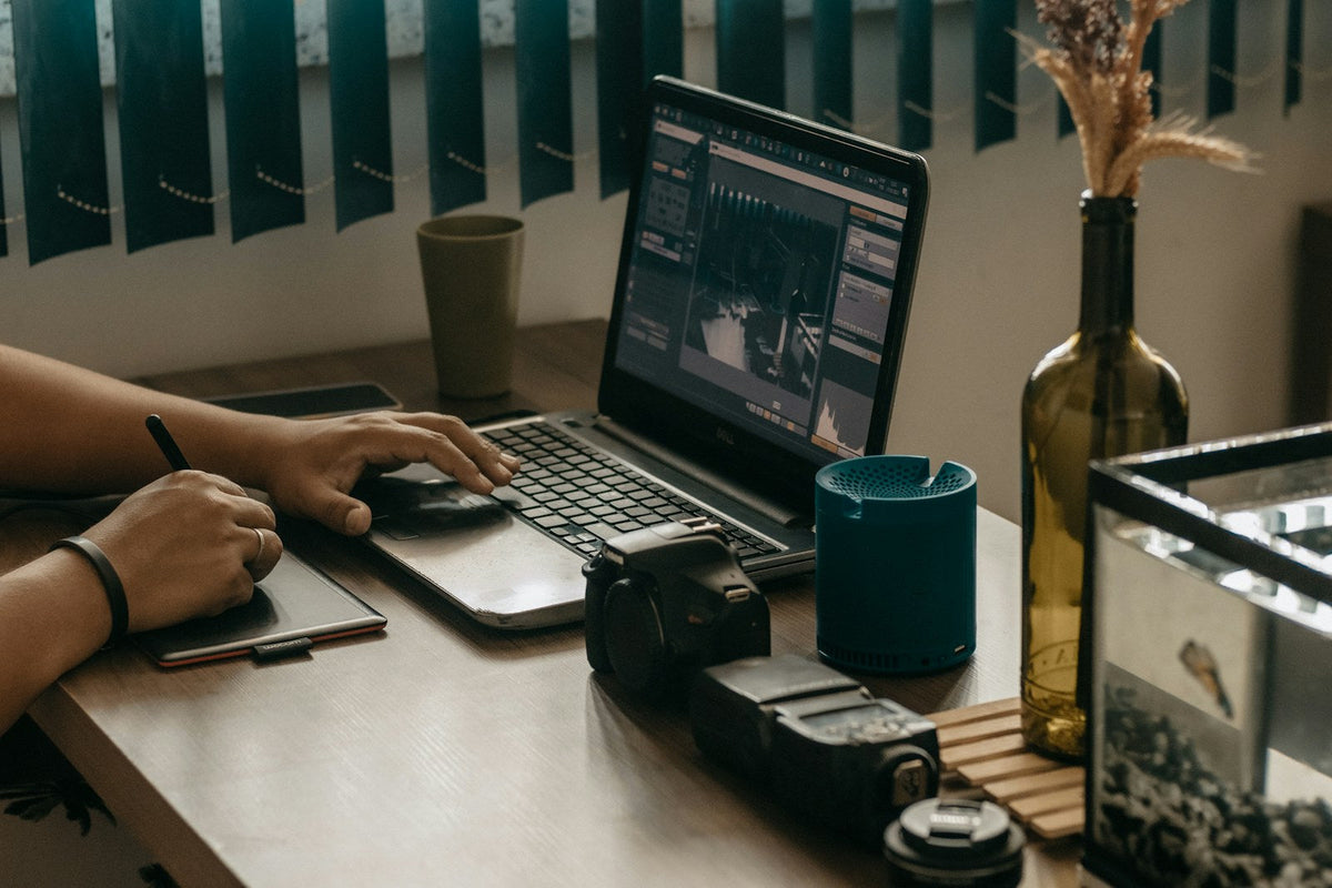 Photographer reviewing work at a desk before applying for a job